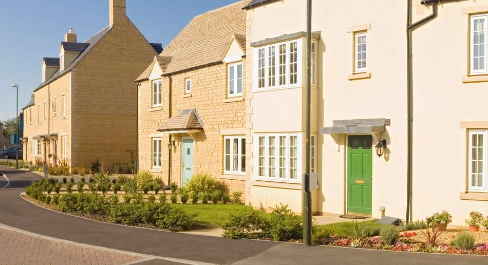 Newly constructed houses with landscaped gardens, showcasing the developers service for residential property.